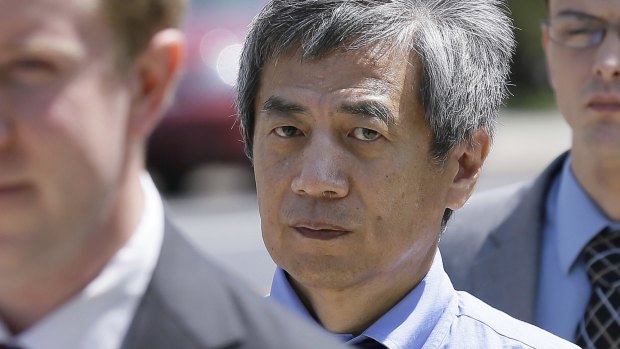 Former Iowa State University researcher Dong Pyou Han leaves the federal courthouse in Des Moines, Iowa.