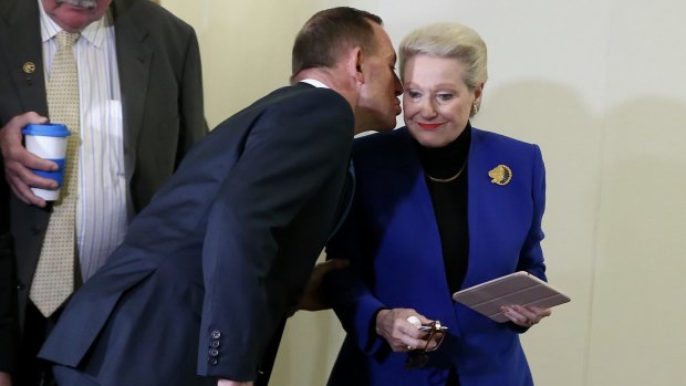 Former prime minister Tony Abbott kisses former speaker Bronwyn Bishop after a vote to replace her.