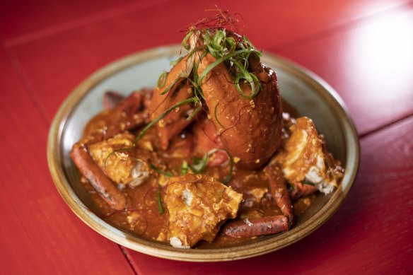 The chilli crab is cooked over high heat until the flesh is velvety, with broken shells for easier eating and saucing.