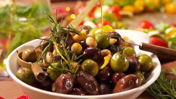 Warm olives with macadamias and chilli