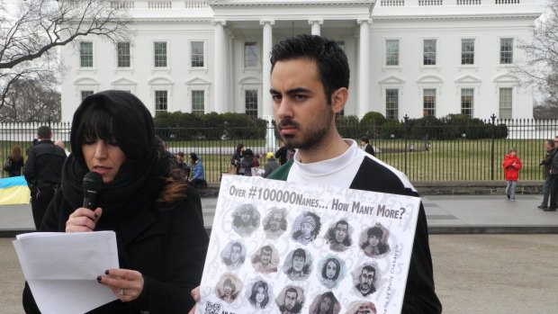 Lina Sergie Attar, left, with Kenan Rahmani, one of the co-founders of How Many More?, spent three days reading the names of Syrian victims outside the White House in Washington last year.