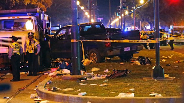 Police guard a pick-up truck that slammed into the crowd watching a Mardi Gras parade in New Orleans.