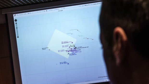 An Italian coast guard officer using a monitor showing the ships navigating the area where the boat believed to be crowded with perhaps as many as 700 migrants capsized in the waters north of Libya on the weekend. 