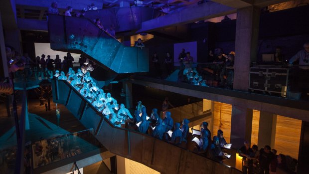 Members of the Tasmanian Symphony Orchestra Chorus perform inside the Museum of Old and New Art at Mofo 2016.