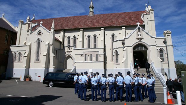 Police officers attend the funeral service for Rozelle blast victims Bianka and Jude O'Brien at St Joseph's Catholic Church in Rozelle