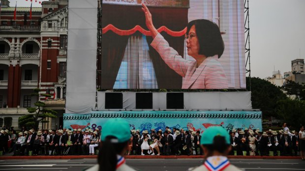 Tsai Ing-wen, Taiwan's incoming president, is seen on a screen as she is sworn in on Friday, May 20, 2016. 