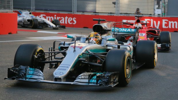 Fuel to the fire: Lewis Hamilton of Mercedes, with Ferrari driver Sebastian Vettel in tow - who appeared to intentionally swerve into the former after running into the back of him.