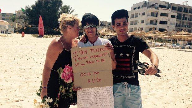 DonnaMarie Douglas from Glasgow hugs a Tunisian local who came to express her solidarity with those who lost their lives in Friday's terror attack.