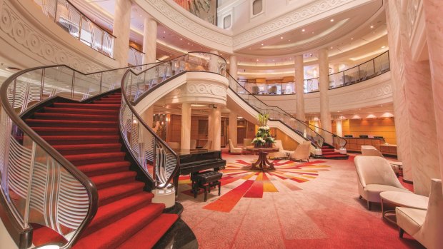 There's a certain elegance attached to the evenings aboard QM2, as everyone promenades about the red-carpeted lobbies in their gowns and suites.