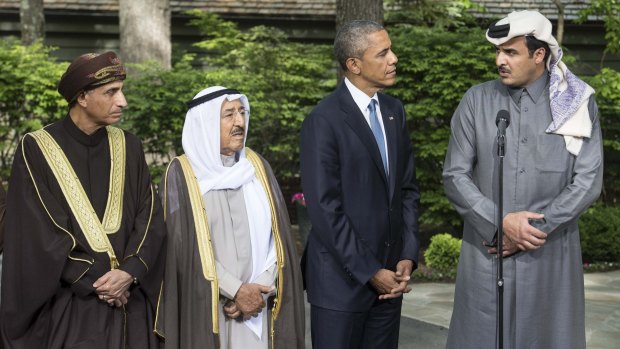 US President Barack Obama (second from right) listens to the emir of Qatar Sheikh Tamim bin Hamad al-Thani (right) at the end of a summit meeting at Camp David.