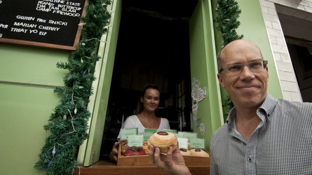 Damian Griffiths, the founder of Doughnut Time, with one of his $6 doughnuts.