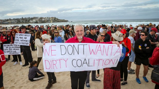 Narayan Van de Graaf from Elizabeth Bay woke up at 3am inspired to make a banner and join 1500 protesters on Bondi Beach.