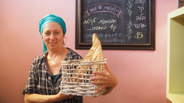 Hadas Meir, who owns Lasha Bakery in Mitzpe Ramon, with some of her handmade loaves.
