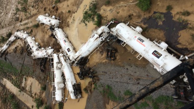 An Aurizon freight train lies beside the tracks after derailing at Julia Creek in Queensland.