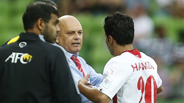 Hamza al-Dardour (right) celebrates with coach Ray Wilkins (centre) during the game against Palestine on Friday.