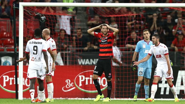 Robbie Cornthwaite of the Wanderers reacts after missing a shot on goal against Adelaide United on Saturday.
