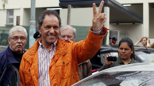 Daniel Scioli, Buenos Aires' province Governor and presidential candidate, gestures after casting his vote in a polling station in Buenos Aires on Sunday.