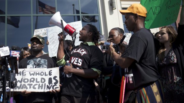 Muhiydin Moye D'Baha of the Black Lives Matter movement leads the protest at a rally in North Charleston. 