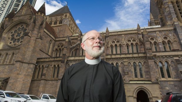 Dean of Brisbane Dr Peter Catt at St John's Anglican Cathedral. It is yet to be repaired after suffering storm damage in November 2014.