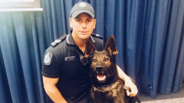 Senior Constable Ash Purvey with his four-year-old police dog Astro.