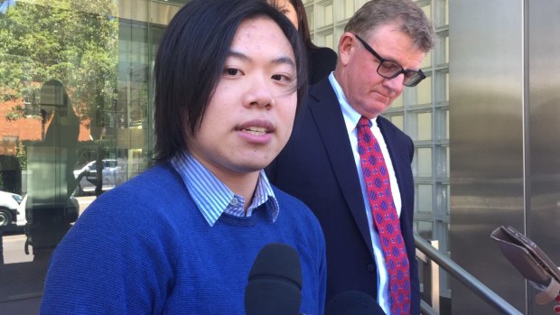 Johnathan Lau speaks outside Glebe Coroner's Court on Monday. 