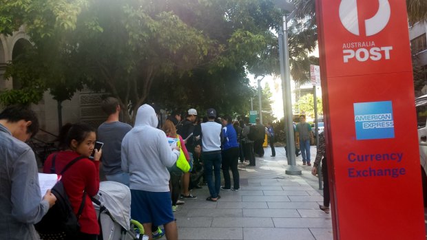 A queue 400 metres long has formed outside the Brisbane CBD Apple store.
