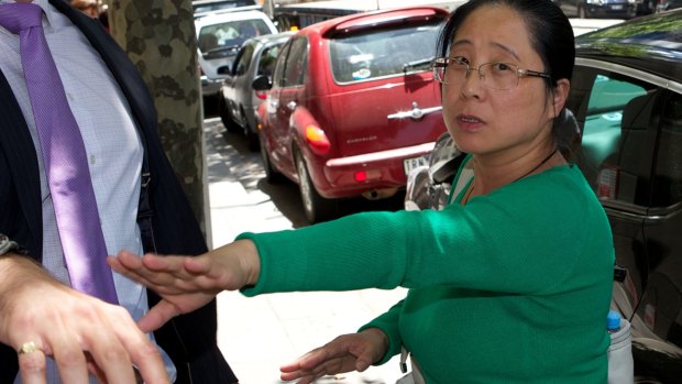 Jian Qing Xu leaves VCAT at an earlier hearing.