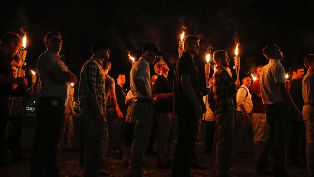 White nationalist groups march through the University of Virginia campus in Charlottesville.