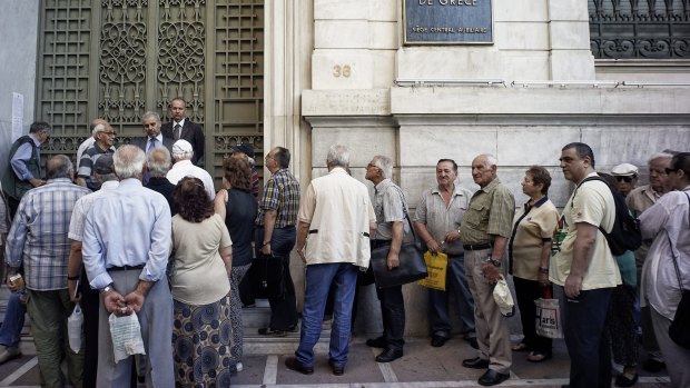 Pensioners line up outside a bank in Athens.
