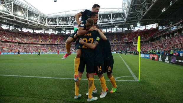 The Socceroos celebrate James Troisi's first-half goal.