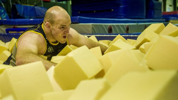 Stephen Moore works out in a foam pit as part of his recovery from knee surgery.