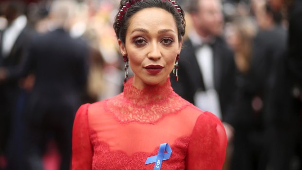 Ruth Negga, wearing the ACLU ribbon, arrives at the Oscars on Sunday, Feb. 26, 2017, at the Dolby Theatre in Los Angeles.
