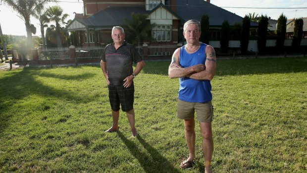 Alan Turner (right) and Paul Robinson live next to land Melbourne Water wants to sell in Rona Street, Reservoir. The land has long been used as a park. 