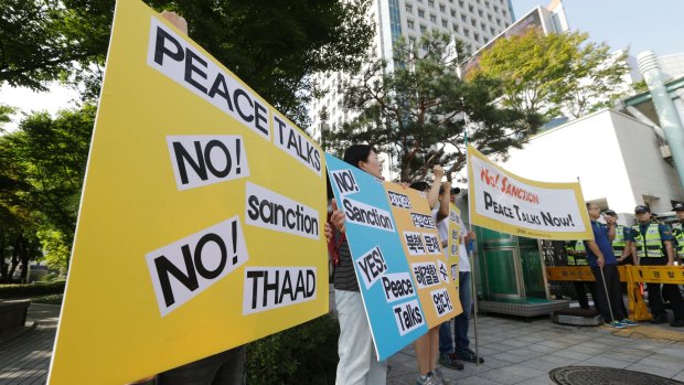 South Korean protesters stage a rally denouncing the United States and South Korean government's policy against North Korea in Seoul.
