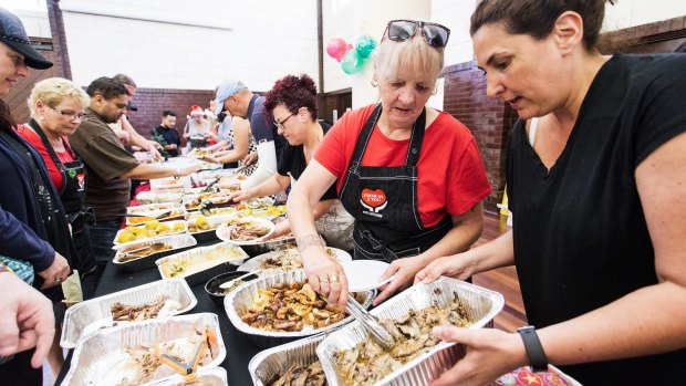 Deborah Henry and fellow volunteers serve Christmas lunch to the disadvantaged at the Drill Hall in Therry Street.