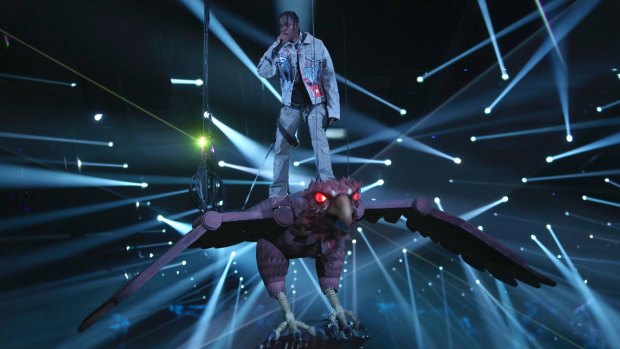 Travis Scott took the stage on a giant hawk.