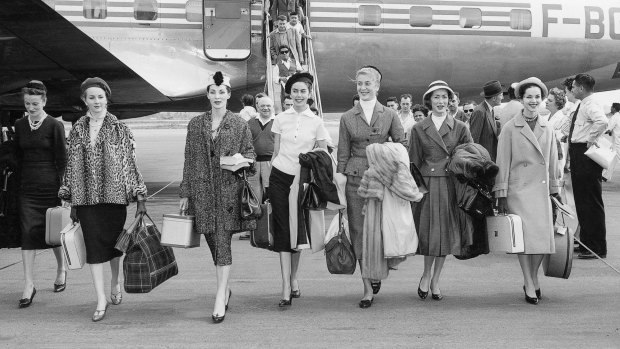 Dior models arriving in Australia for the presentation of the autumn-winter 1957 haute couture collection – Christian Dior's last collection.