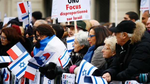 Pro-Israel demonstrators     outside the Israeli embassy in Paris on Sunday.