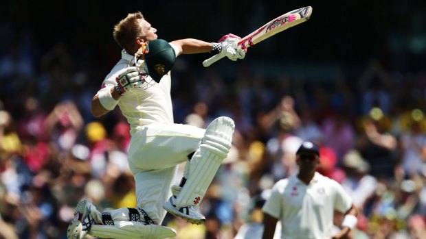 Jump for joy: In typical style, David Warner celebrates his century at the SCG.