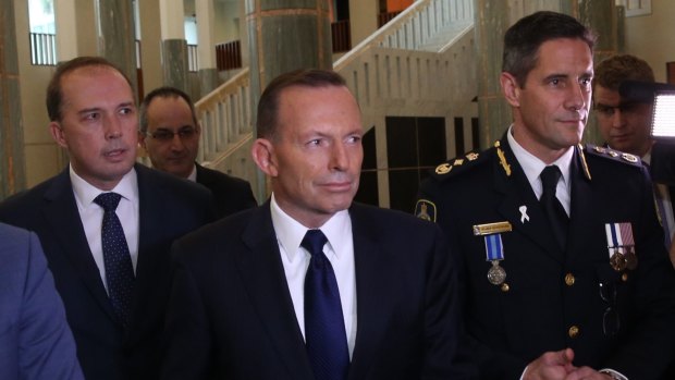 Immigration Minister Peter Dutton, Prime Minister Tony Abbott and Australian Border Force commissioner Roman Quaedvlieg.