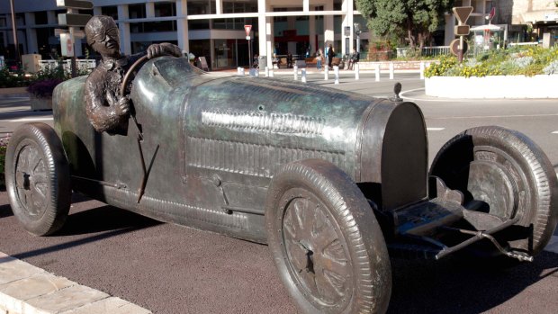 The bronze statue of British bolter William Grover-Williams at the wheel of his Bugatti 35B.
