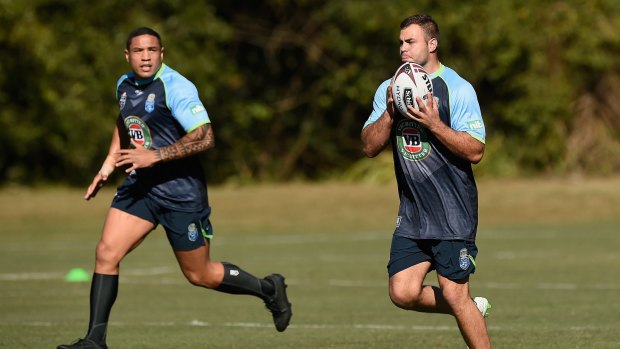 Raw deal: Wade Graham looks to pass the ball to the man who replaced him for Origin II, Tyson Frizell. 