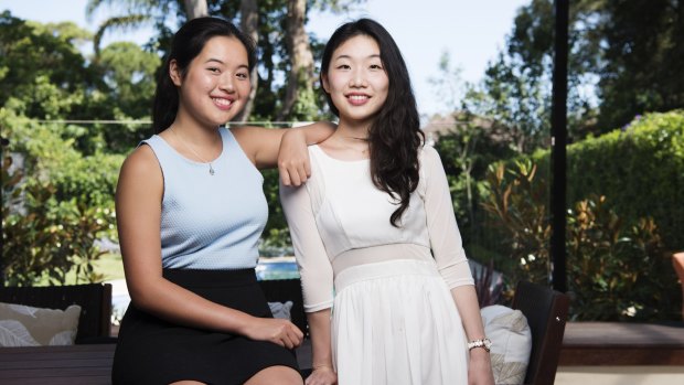 Karen Zhang, left, got 99.95 in her ATAR this year - the same mark as her sister, Kim.