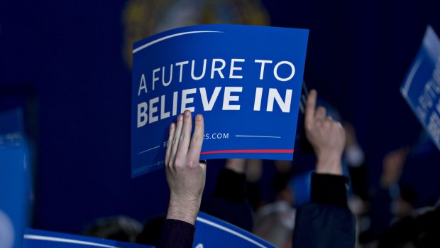 Attendees hold up signs for Vermont senator Bernie Sanders in New Hampshire.