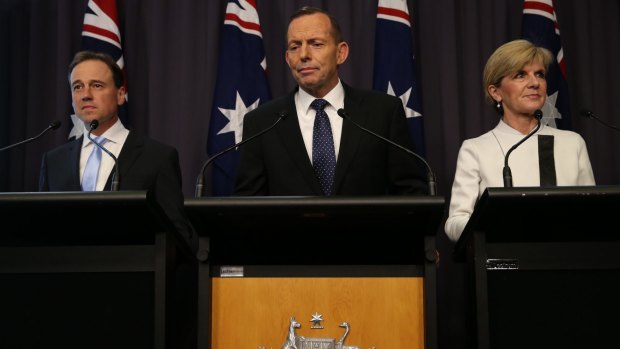 Prime Minister Tony Abbott announces Australia's post-2020 emissions reduction target with Environment Minister Greg Hunt and Foreign Affairs Minister Julie Bishop on Tuesday.