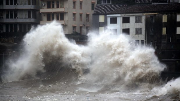 A strong wave breaks along the shore ahead of the landfall of Typhoon Chan-Hom in Wenling on Friday.