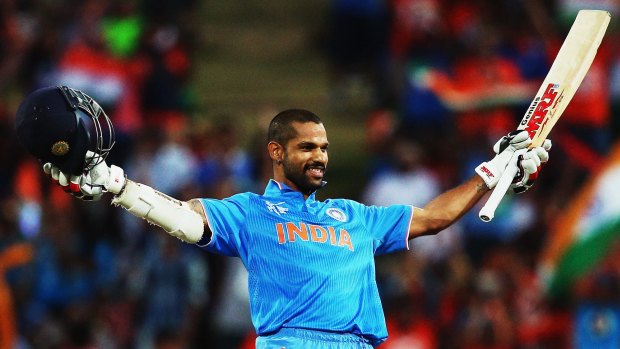 Indian opener Shikhar Dhawan celebrates after scoring his second century in the tournament.