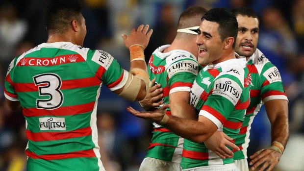 Bryson Goodwin of the Rabbitohs celebrates with teammates after the game.