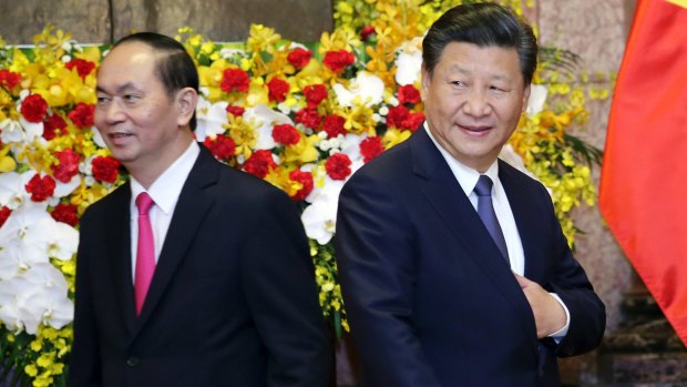 Chinese President Xi Jinping, right, and Vietnamese President Tran Dai Quang attend a meeting at the Presidential Palace in Hanoi, Vietnam.