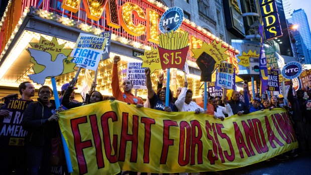 Protestors pause near a McDonald's restaurant in Times Square during a rally in New York on Wednesday.